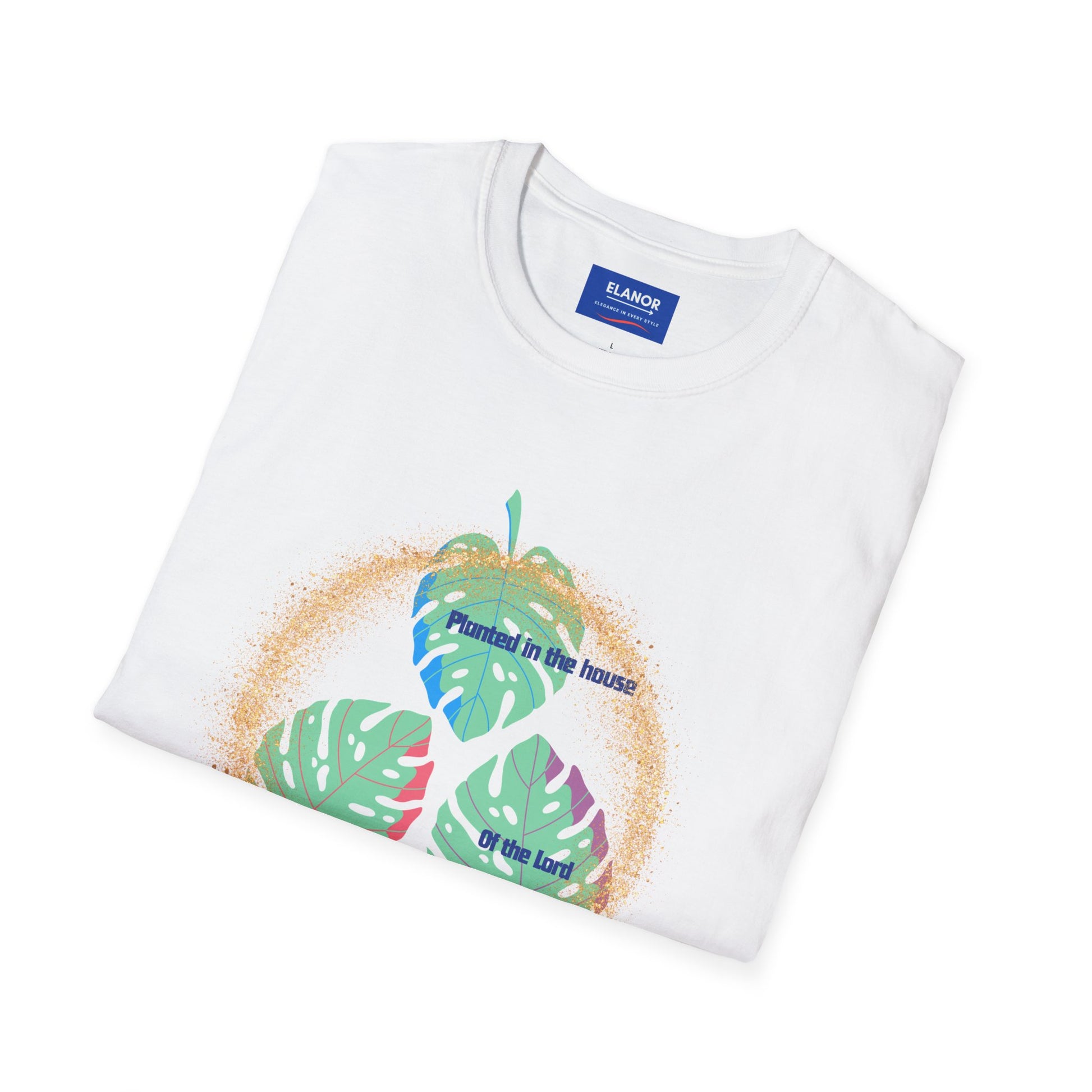 White t-shirt with tropical leaf design and text, folded on a white background