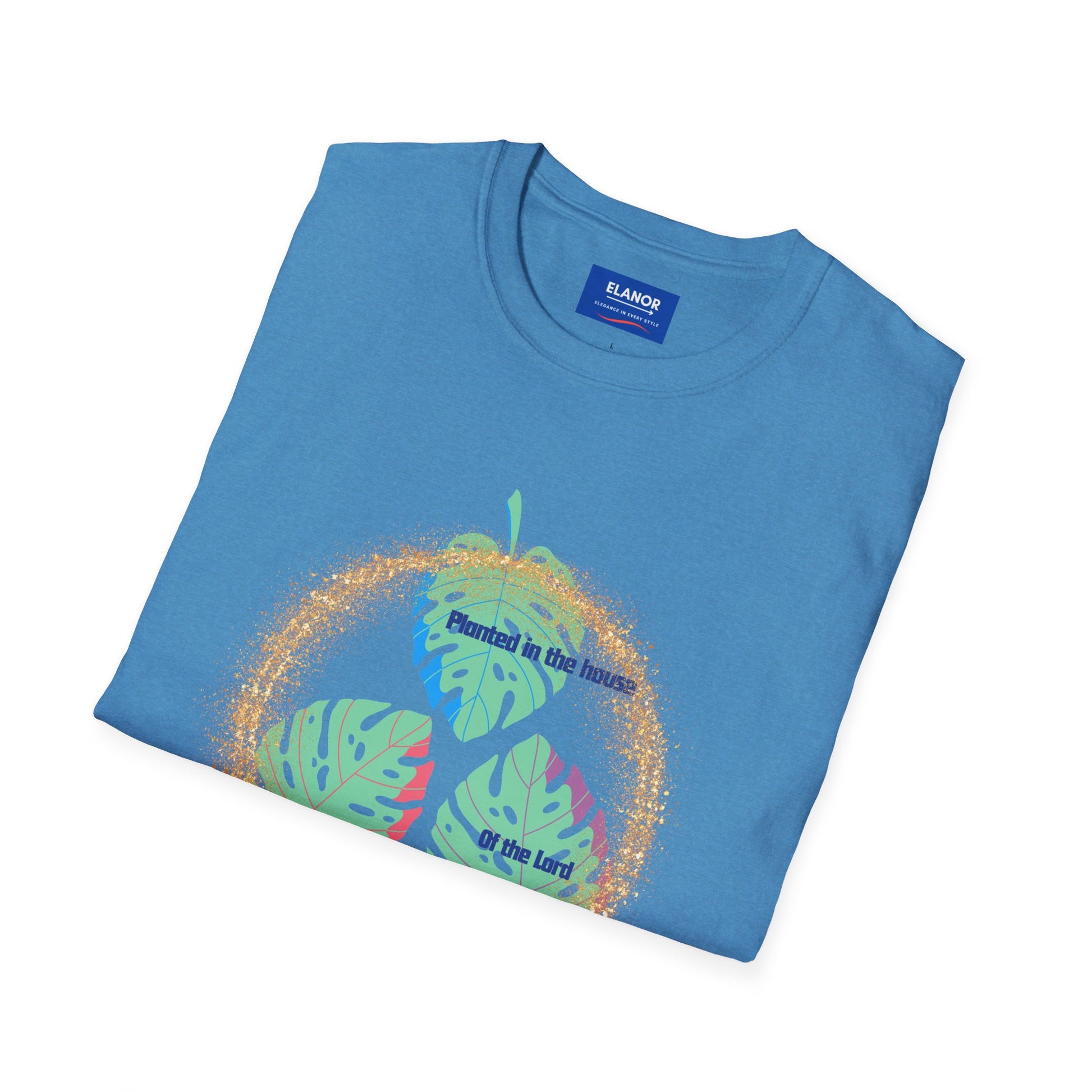 Folded blue t-shirt with colorful leaf design and text on a white background
