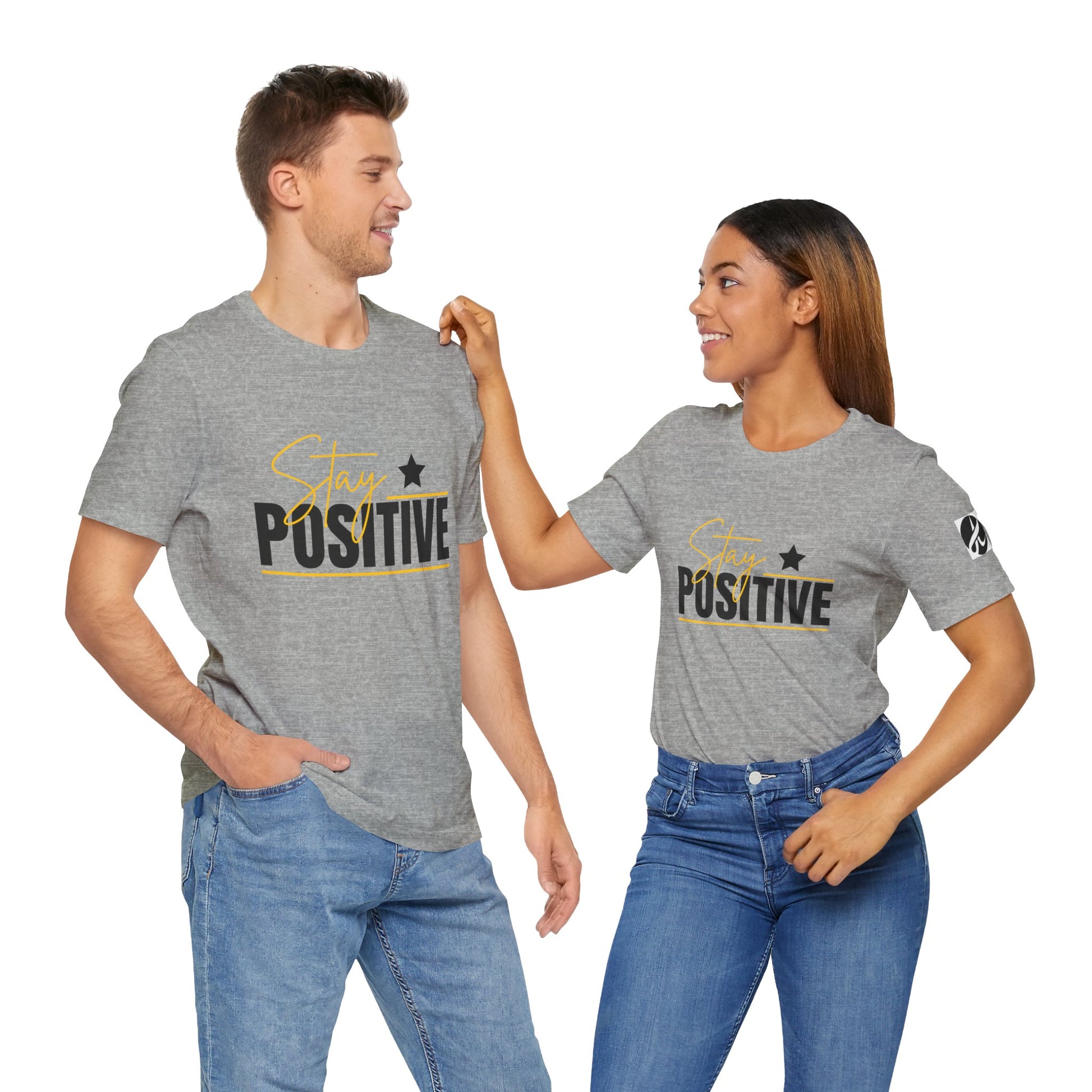 Two people wearing gray t-shirts with 'Stay Positive' text on a white background