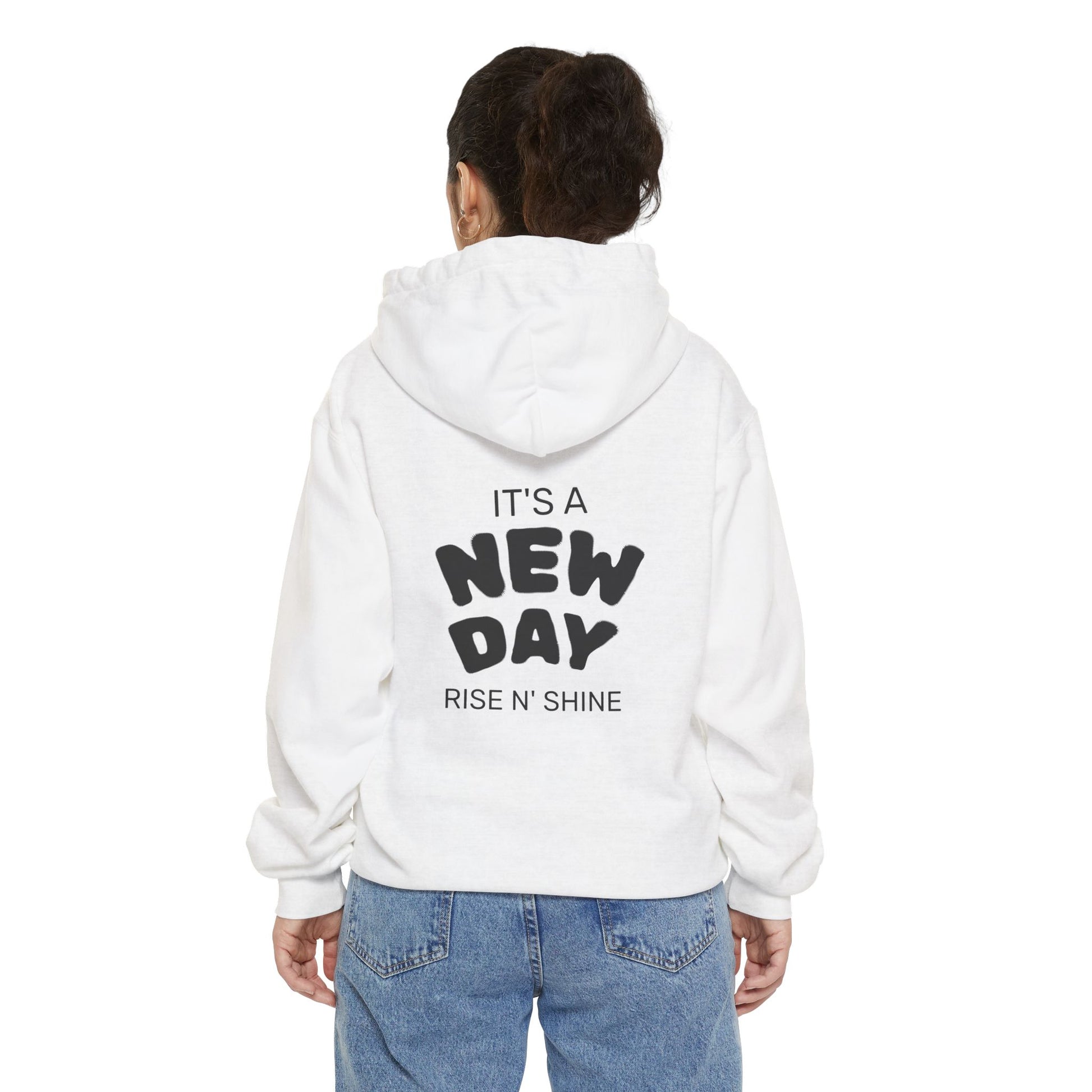 Person wearing a white hoodie with text on the back, standing against a white background