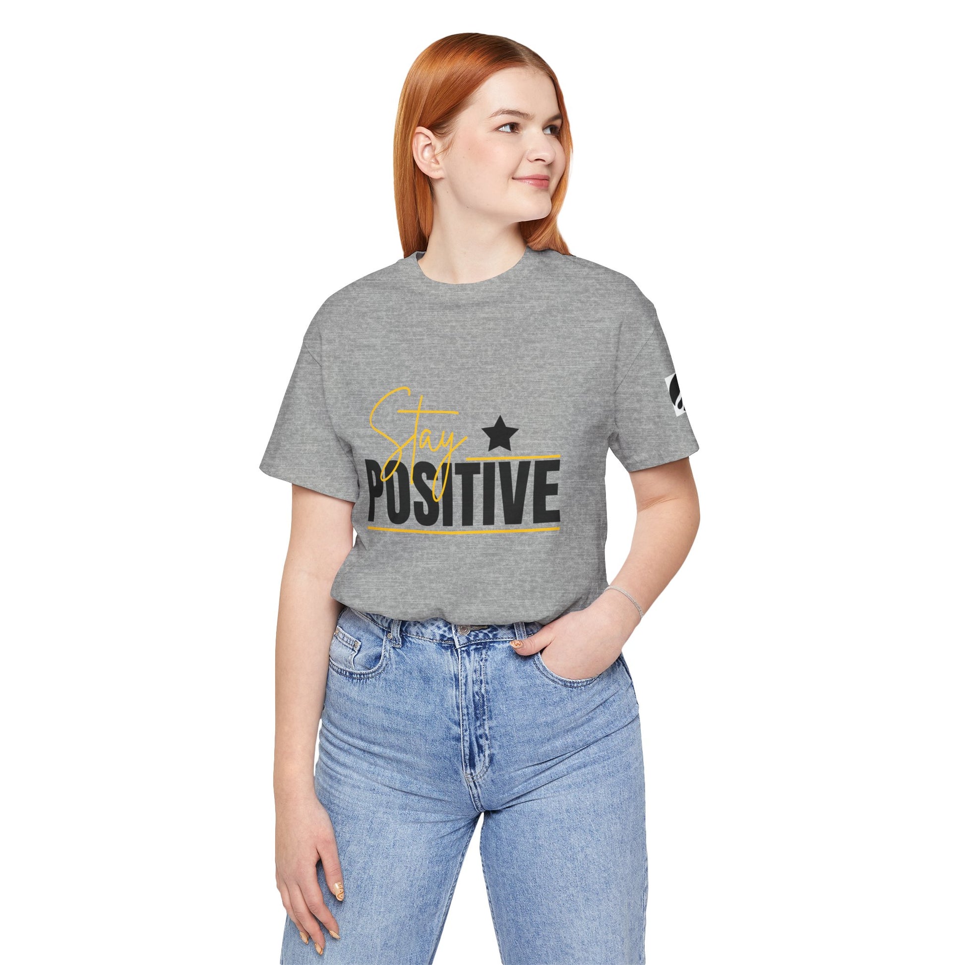 Person wearing a gray t-shirt with 'Stay Positive' text on a white background
