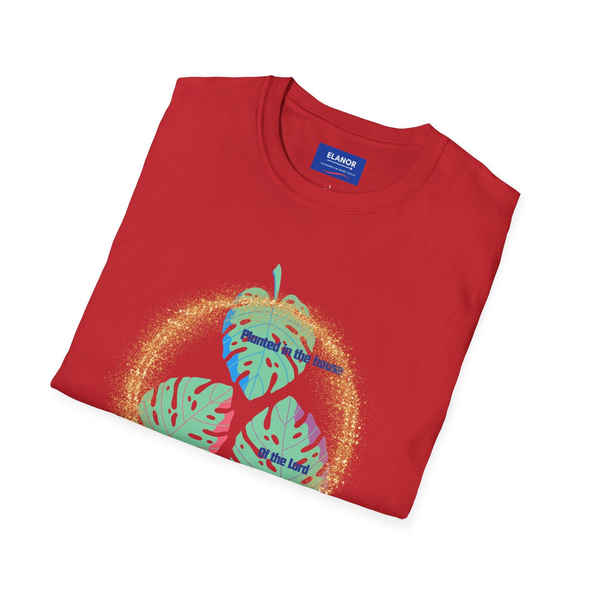Folded red t-shirt with colorful design and 'Emanuel' brand label on a white background