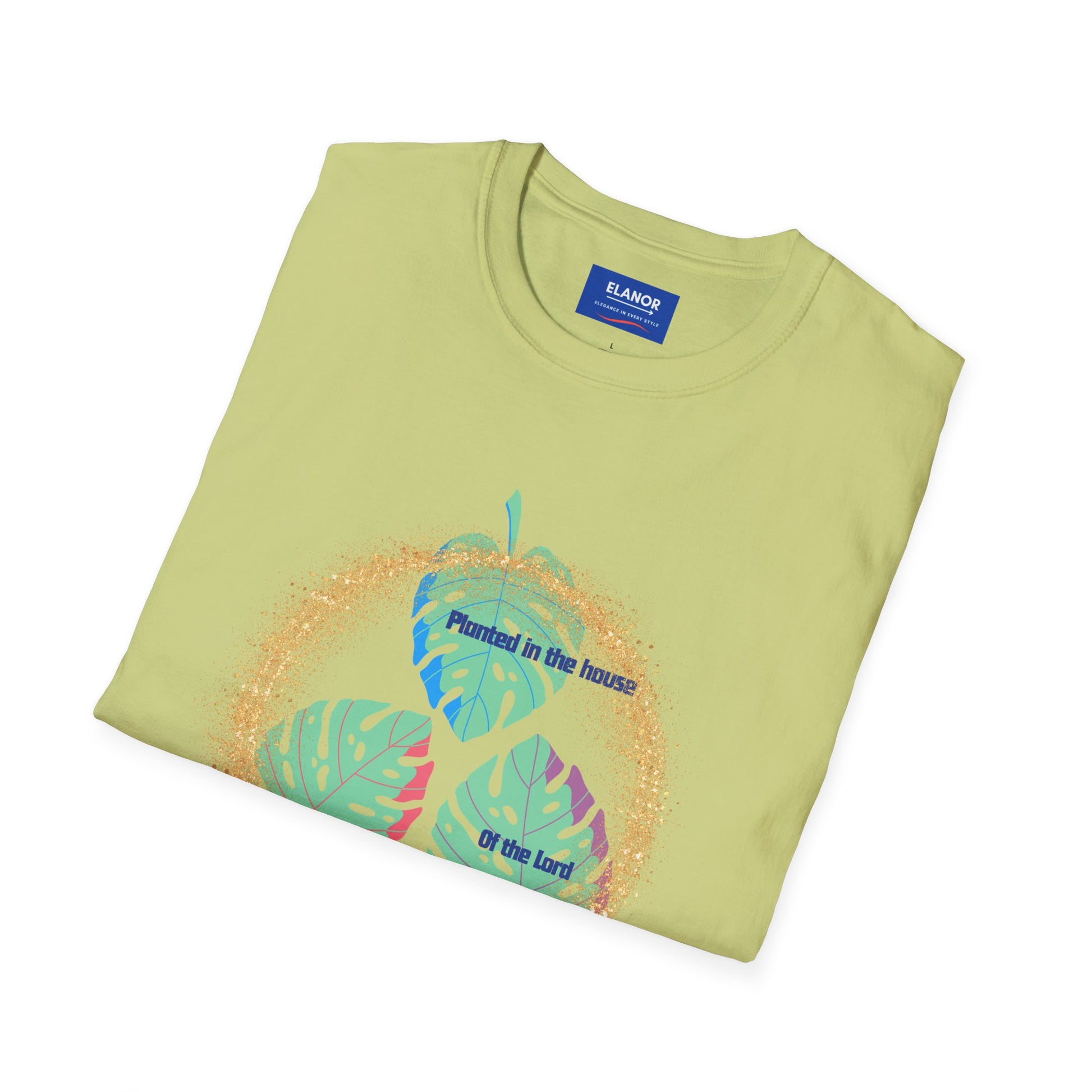 Folded green t-shirt with leaf design and text on a white background