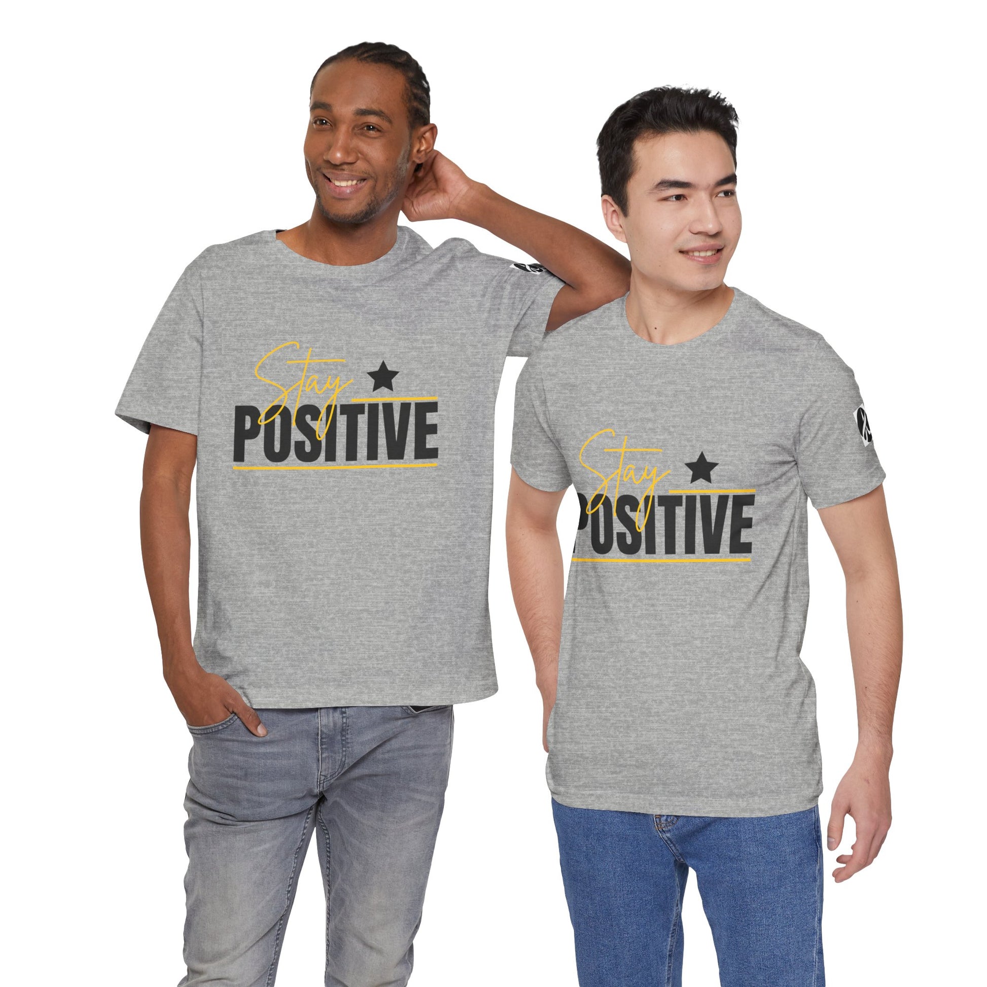 Two people wearing gray t-shirts with 'Stay Positive' text on a white background
